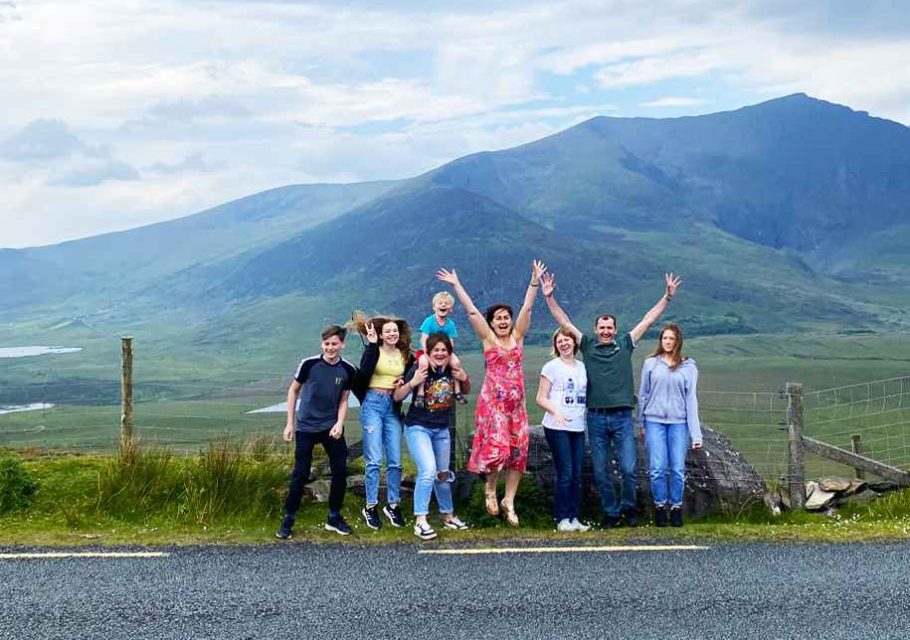 Smiling family enjoying a private tour in County Kerry, surrounded by Ireland’s beautiful natural landscapes.